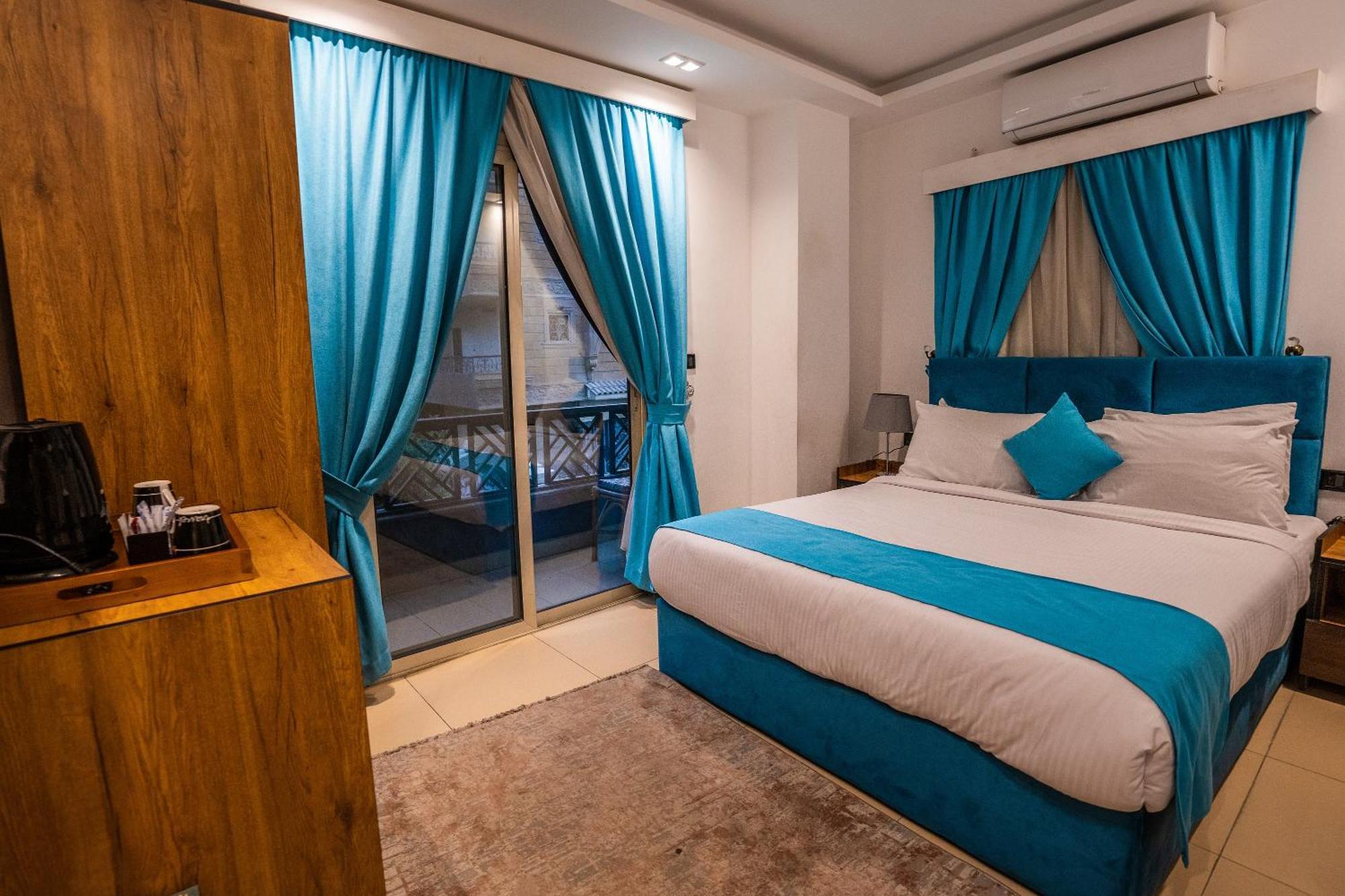 Pyramids Gem Plaza Hotel Kafrat al Jabal Bagian luar foto